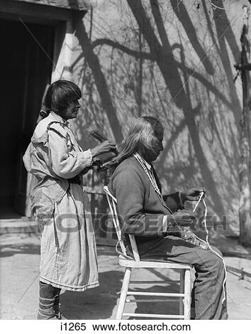 1930S Native American Woman Combing Hair Of Elderly Man With Straw Comb Cochiti Pueblo New Mexico Usa View Large Photo Image Stock Photography - 1930S Native American Woman Combing Hair Of Elderly Man With Straw Comb Cochiti Pueblo New Mexico Usa. Fotosearch