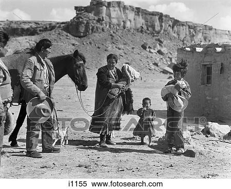 1930S Navajo Native American Family At Their Adobe Home Man Woman Mother Father Children Boy Baby Horse View Large Photo Image Stock Photography - 1930S Navajo Native American Family At Their Adobe Home Man Woman Mother Father Children Boy Baby Horse . Fotosearch