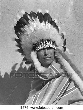 1930S Portrait Native American Indian Man Wearing Full Feathered Headdress War Bonnet San Ildefonso Pueblo New Mexico Usa View Large Photo Image Stock Photograph - 1930S Portrait Native American Indian Man Wearing Full Feathered Headdress War Bonnet San Ildefonso Pueblo New Mexico Usa. Fotosearch