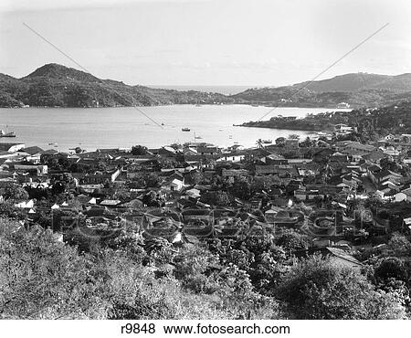 Stock Photo - 1930s SCENIC VIEW OF TOWN AND HARBOR ACAPULCO MEXICO. Fotosearch