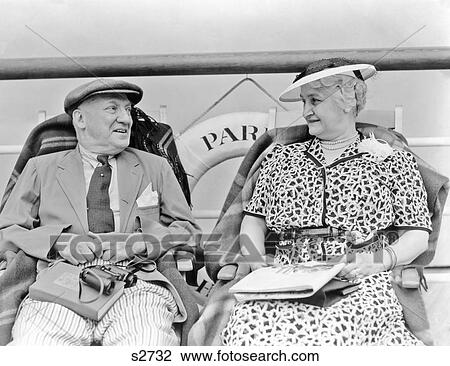1930S Senior Couple Sitting In Deck Chairs On Transatlantic Ocean Liner View Large Photo Image Stock Image - 1930S Senior Couple Sitting In Deck Chairs On Transatlantic Ocean Liner. Fotosearch