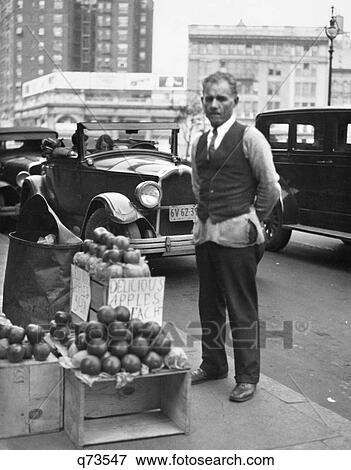 1930S Sidewalk Apple Vendor Man Looking At Camera During The Great Depression View Large Photo Image Stock Photo - 1930S Sidewalk Apple Vendor Man Looking At Camera During The Great Depression. Fotosearch