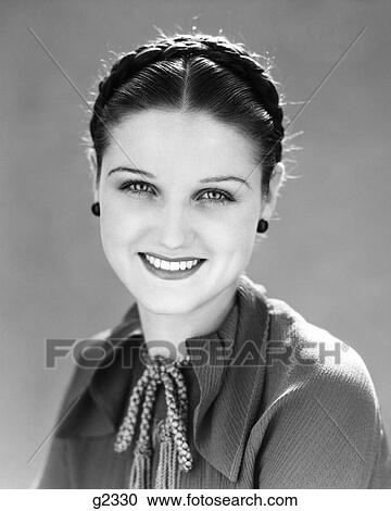 1930S Smiling Pretty Brunette Woman Portrait Hair Braided Looking At Camera View Large Photo Image Stock Image - 1930S Smiling Pretty Brunette Woman Portrait Hair Braided Looking At Camera. Fotosearch