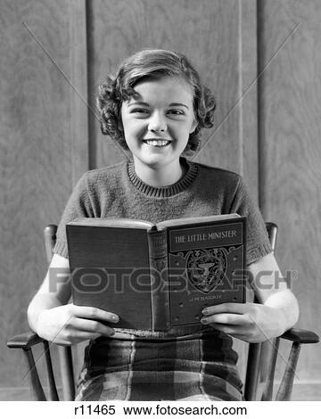1930s SMILING TEEN GIRL READING BOOK THE LITTLE MINISTER LOOKING AT CAMERA View Large Photo Image Stock Photography - 1930s SMILING TEEN GIRL READING BOOK THE LITTLE MINISTER LOOKING AT CAMERA. Fotosearch