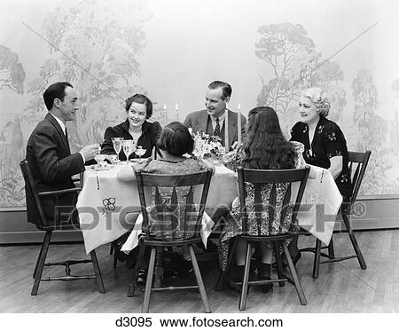 1930s THREE GENERATION FAMILY MEN WOMEN CHILDREN DINING AT TABLE TOGETHER BY CANDLELIGHT View Large Photo Image Stock Photography - 1930s THREE GENERATION FAMILY MEN WOMEN CHILDREN DINING AT TABLE TOGETHER BY CANDLELIGHT. Fotosearch