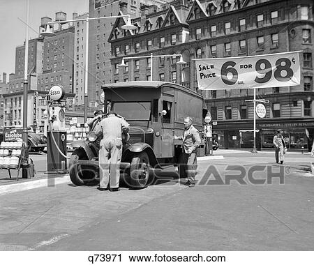 1930s TRUCK FILLING UP AT ESSO GAS STATION ADVERTISING 6 GALLONS FOR 98 CENTS AT BROADWAY & 68th STREET NEW YORK CITY USA View Large Photo Image Stock Image - 1930s TRUCK FILLING UP AT ESSO GAS STATION ADVERTISING 6 GALLONS FOR 98 CENTS AT BROADWAY & 68th STREET NEW YORK CITY USA. Fotosearch