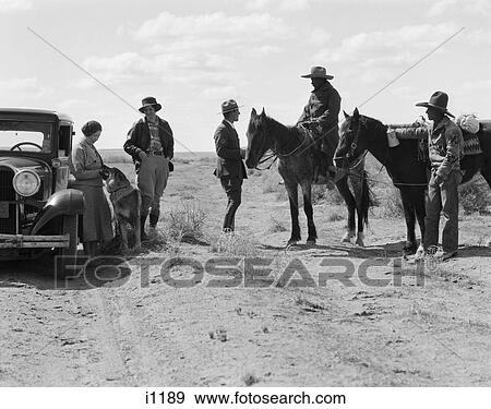 1930S Two Native American Navajo Indian Men With Ponies Stop To Speak To Park Ranger With Two Women Tourists View Large Photo Image Stock Photo - 1930S Two Native American Navajo Indian Men With Ponies Stop To Speak To Park Ranger With Two Women Tourists. Fotosearch