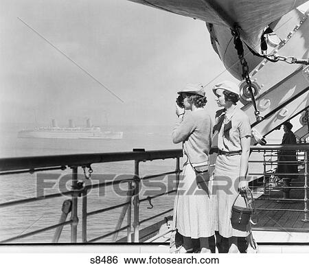 Stock Photograph - 1930S Two Women Filming With 8Mm Home Movie Camera On Deck Of Transatlantic Ocean Liner Ship. Fotosearch