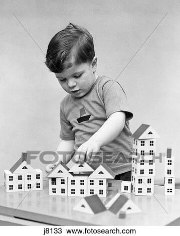 1940s 1930s BOY PLAYING WITH BUILDING BLOCKS View Large Photo Image Stock Image - 1940s 1930s BOY PLAYING WITH BUILDING BLOCKS. Fotosearch