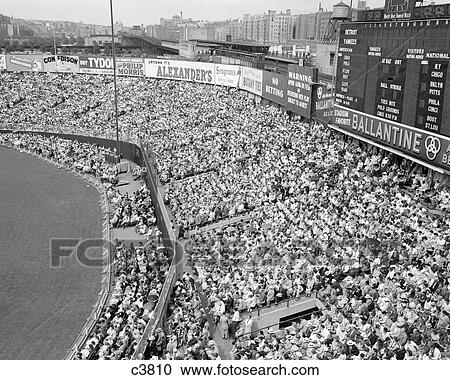 Stock Image - 1940S 1950S Large Crowd Yankee Stadium Bronx Nyc Bleachers Advertising Signs Around The Stadium New York City Ny Usa. Fotosearch