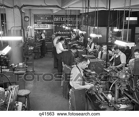 1940s 1950s MEN WEARING MACHINIST APRONS WORKING LATHE MACHINES INDOOR AT METROPOLITAN INDUSTRIAL SCHOOL View Large Photo Image Stock Image - 1940s 1950s MEN WEARING MACHINIST APRONS WORKING LATHE MACHINES INDOOR AT METROPOLITAN INDUSTRIAL SCHOOL. Fotosearch