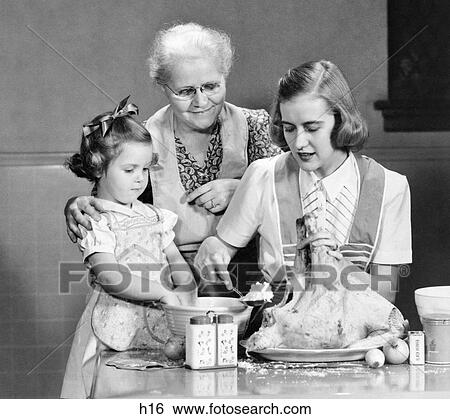 1940s 1950s MOTHER DAUGHTER GRANDMOTHER STUFFING THANKSGIVING TURKEY View Large Photo Image Stock Photograph - 1940s 1950s MOTHER DAUGHTER GRANDMOTHER STUFFING THANKSGIVING TURKEY. Fotosearch