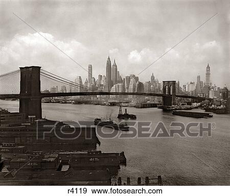 1940s 1950s NYC NEW YORK CITY SKYLINE AND BROOKLYN BRIDGE FROM BROOKLYN View Large Photo Image Stock Photo - 1940s 1950s NYC NEW YORK CITY SKYLINE AND BROOKLYN BRIDGE FROM BROOKLYN. Fotosearch