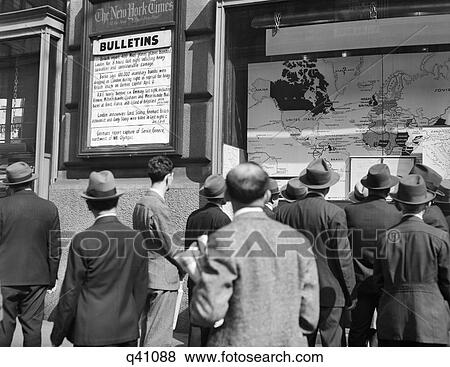 1940s CROWD AROUND THE WAR BULLETINS AT NEW YORK TIMES BUILDING STUDYING THE WORLD WAR II NEWS AND MAPS NYC USA View Large Photo Image Stock Photo - 1940s CROWD AROUND THE WAR BULLETINS AT NEW YORK TIMES BUILDING STUDYING THE WORLD WAR II NEWS AND MAPS NYC USA. Fotosearch