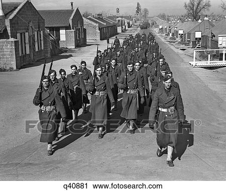 1940S Fort Dix New Jersey Troops Of The 44Th Division Marching In Cantonment Street Of Fort Dix Nj View Large Photo Image Stock Image - 1940S Fort Dix New Jersey Troops Of The 44Th Division Marching In Cantonment Street Of Fort Dix Nj. Fotosearch