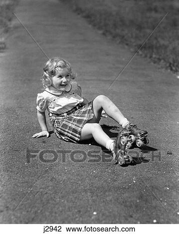 1940s GIRL FALLING DOWN SITTING ON SIDEWALK WEARING METAL ROLLER SKATES View Large Photo Image Stock Image - 1940s GIRL FALLING DOWN SITTING ON SIDEWALK WEARING METAL ROLLER SKATES. Fotosearch