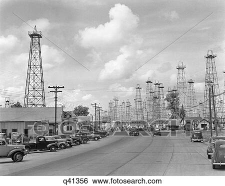 1940s HIGHWAY THROUGH FOREST OF OIL DERRICKS KILGORE TEXAS USA View Large Photo Image Stock Photograph - 1940s HIGHWAY THROUGH FOREST OF OIL DERRICKS KILGORE TEXAS USA. Fotosearch