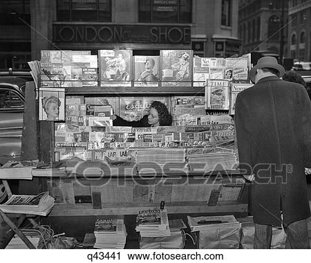 1940s MAGAZINE NEWSSTAND AT NIGHT CORNER 42ND STREET & MADISON AVENUE NEW YORK CITY USA View Large Photo Image Stock Image - 1940s MAGAZINE NEWSSTAND AT NIGHT CORNER 42ND STREET & MADISON AVENUE NEW YORK CITY USA. Fotosearch