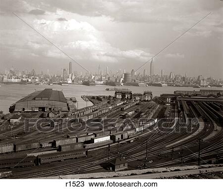 1940s NEW YORK CITY MANHATTAN MIDTOWN SKYLINE FROM RAILROAD YARD IN NEW JERSEY USA View Large Photo Image Stock Image - 1940s NEW YORK CITY MANHATTAN MIDTOWN SKYLINE FROM RAILROAD YARD IN NEW JERSEY USA. Fotosearch