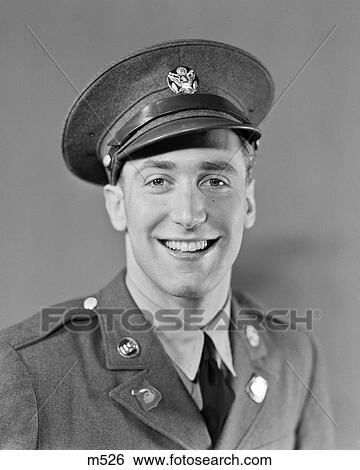 Stock Photograph - 1940S Portrait Smiling Man Soldier In Army Uniform Looking At Camera. Fotosearch