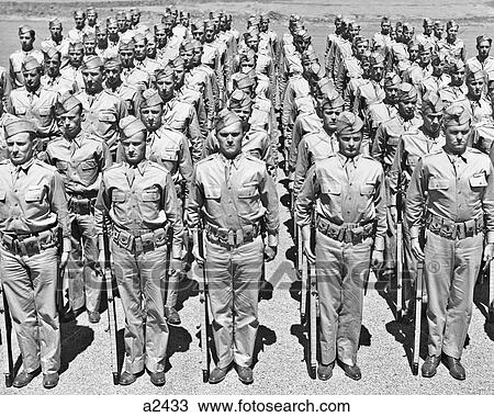 1940s ROWS OF AMERICAN WORLD WAR II SOLDIERS STANDING AT ATTENTION WITH RIFLES View Large Photo Image Stock Image - 1940s ROWS OF AMERICAN WORLD WAR II SOLDIERS STANDING AT ATTENTION WITH RIFLES. Fotosearch