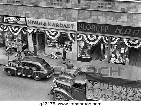 1940S Store Fronts Decorated With Parade Bunting Main Street 82Nd Street Jackson Heights Queens New York City Usa View Large Photo Image Stock Photography - 1940S Store Fronts Decorated With Parade Bunting Main Street 82Nd Street Jackson Heights Queens New York City Usa. Fotosearch