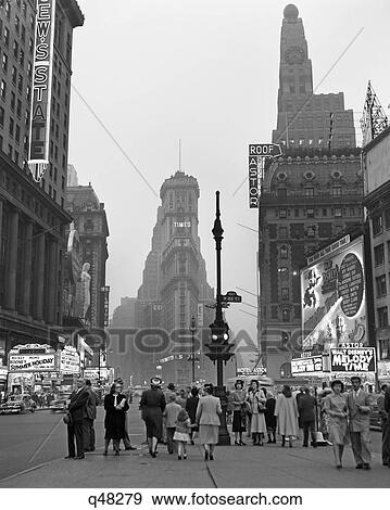 1940S Times Square At Twilight Night Looking South From Duffy Square Towards Ny Times Building Pedestrians Neon Movie Marquees View Large Photo Image Stock Photo - 1940S Times Square At Twilight Night Looking South From Duffy Square Towards Ny Times Building Pedestrians Neon Movie Marquees. Fotosearch