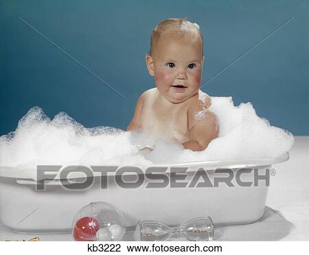 1950s 1960s CLEAN HAPPY BABY SITTING IN PLASTIC BATH TUB BASIN FULL OF SOAP SUDS View Large Photo Image Stock Image - 1950s 1960s CLEAN HAPPY BABY SITTING IN PLASTIC BATH TUB BASIN FULL OF SOAP SUDS. Fotosearch