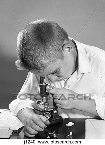 1950S 1960S Close-Up Of Boy Looking Down Through Microscope View Large Photo Image Stock Image - 1950S 1960S Close-Up Of Boy Looking Down Through Microscope. Fotosearch