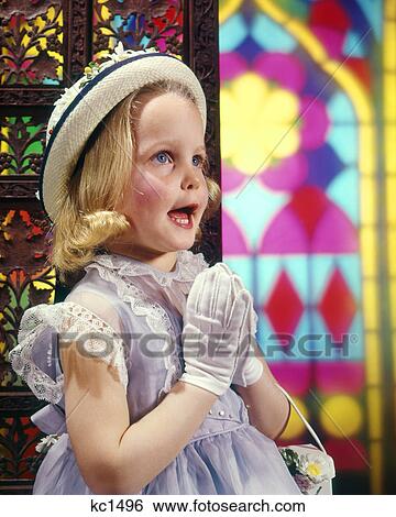 1950s 1960s LITTLE GIRL SINGING AND PRAYING IN CHURCH BY STAINED GLASS WINDOWS View Large Photo Image Stock Photograph - 1950s 1960s LITTLE GIRL SINGING AND PRAYING IN CHURCH BY STAINED GLASS WINDOWS. Fotosearch