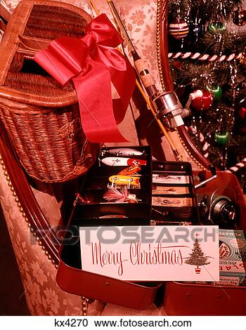 1950s 1960s MERRY CHRISTMAS PRESENTS RED RIBBON ON FISHING CREEL TACKLE BOX OF LURES AND FISHING ROD AND REEL View Large Photo Image Stock Image - 1950s 1960s MERRY CHRISTMAS PRESENTS RED RIBBON ON FISHING CREEL TACKLE BOX OF LURES AND FISHING ROD AND REEL. Fotosearch