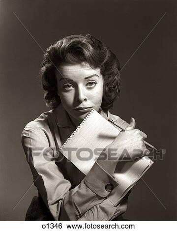 1950s 1960s OVERWORKED WOMAN SECRETARY STENOGRAPHER OFFICE WORKER LEANING CHIN ON STENO PAD AND PENCIL LOOKING AT CAMERA View Large Photo Image Stock Photograph - 1950s 1960s OVERWORKED WOMAN SECRETARY STENOGRAPHER OFFICE WORKER LEANING CHIN ON STENO PAD AND PENCIL LOOKING AT CAMERA. Fotosearch