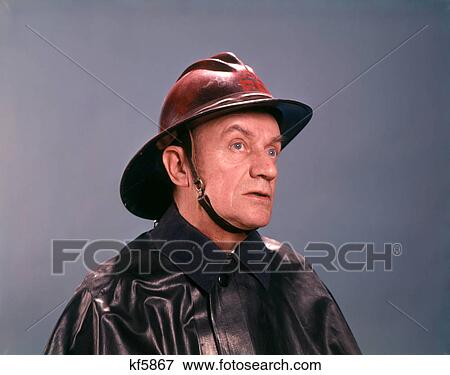 Stock Photo - 1950s 1960s SERIOUS MAN FIREMAN FIREFIGHTER PORTRAIT. Fotosearch