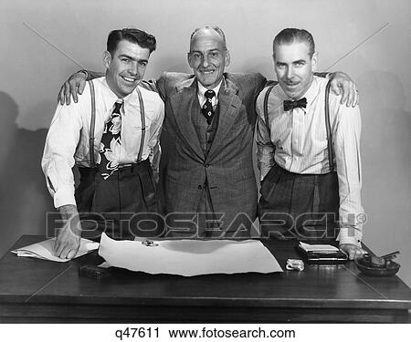 1950S 3 Generations Of Businessmen At Desk Arm In Arm Smiling Looking At Camera View Large Photo Image Stock Image - 1950S 3 Generations Of Businessmen At Desk Arm In Arm Smiling Looking At Camera. Fotosearch