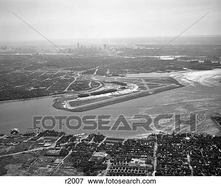 1950S Aerial Across Flushing Bay La Guardia Airport College Point Queens Manhattan Skyline In Distance Looking West View Large Photo Image Stock Photo - 1950S Aerial Across Flushing Bay La Guardia Airport College Point Queens Manhattan Skyline In Distance Looking West. Fotosearch