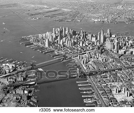 1950S Aerial Of Downtown Manhattan East And Hudson Rivers Meet In Harbor Brooklyn And Manhattan Bridges View Large Photo Image Stock Photography - 1950S Aerial Of Downtown Manhattan East And Hudson Rivers Meet In Harbor Brooklyn And Manhattan Bridges. Fotosearch