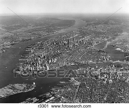 1950s AERIAL VIEW OF MANHATTAN ISLAND ON LEFT IS HUDSON RIVER ON RIGHT IS EAST RIVER AND BROOKLYN LOWER LEFT IS GOVERNORS ISLAND View Large Photo Image Stock Image - 1950s AERIAL VIEW OF MANHATTAN ISLAND ON LEFT IS HUDSON RIVER ON RIGHT IS EAST RIVER AND BROOKLYN LOWER LEFT IS GOVERNORS ISLAND. Fotosearch