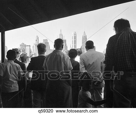 1950S Anonymous Silhouetted Passengers On Staten Island Ferry Coming Into Downtown Manhattan New York City Ny Usa View Large Photo Image Stock Image - 1950S Anonymous Silhouetted Passengers On Staten Island Ferry Coming Into Downtown Manhattan New York City Ny Usa. Fotosearch