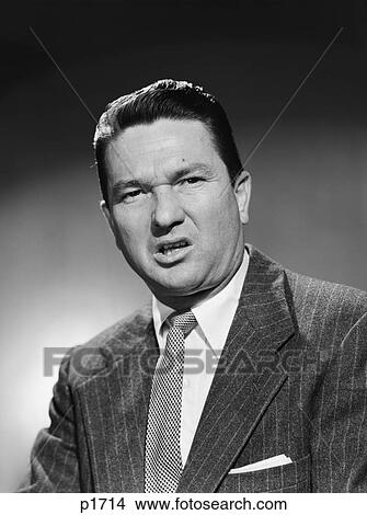 1950S Businessman In Suit Making Funny Serious Frown Facial Expression Sneer Disgust Anger Unhappy Angry Unpleasant Mean Grouchy View Large Photo Image Picture - 1950S Businessman In Suit Making Funny Serious Frown Facial Expression Sneer Disgust Anger Unhappy Angry Unpleasant Mean Grouchy. Fotosearch