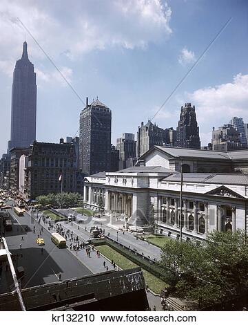 1950s ELEVATED VIEW LOOKING DOWN ON NY PUBLIC LIBRARY WITH EMPIRE STATE BUILDING ON FAR LEFT FIFTH AVENUE NYC USA View Large Photo Image Stock Image - 1950s ELEVATED VIEW LOOKING DOWN ON NY PUBLIC LIBRARY WITH EMPIRE STATE BUILDING ON FAR LEFT FIFTH AVENUE NYC USA. Fotosearch