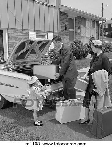 1950s FAMILY PACKING LUGGAGE INTO CAR TRUNK View Large Photo Image Stock Photo - 1950s FAMILY PACKING LUGGAGE INTO CAR TRUNK. Fotosearch