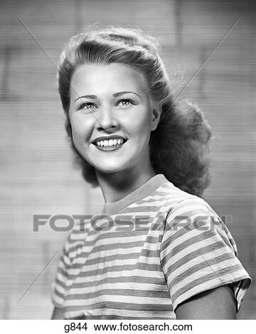 1950s FRESH FACED SMILING TEENAGE WOMAN LOOKING AT CAMERA STRIPED BLOUSE HAIR SLIGHTLY WIND BLOWN View Large Photo Image Picture - 1950s FRESH FACED SMILING TEENAGE WOMAN LOOKING AT CAMERA STRIPED BLOUSE HAIR SLIGHTLY WIND BLOWN. Fotosearch