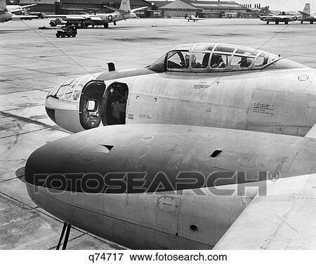 1950s FRONT OF JET AIRPLANE SLIDING COCKPIT FORWARD GUN BAY WITH DOOR OPEN ON TARMAC AT LANGLEY AIR FORCE BASE HAMPTON VA USA View Large Photo Image Stock Photo - 1950s FRONT OF JET AIRPLANE SLIDING COCKPIT FORWARD GUN BAY WITH DOOR OPEN ON TARMAC AT LANGLEY AIR FORCE BASE HAMPTON VA USA. Fotosearch