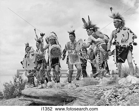 Stock Image - 1950S Group Of Native American Taos Indian Men Performing Dance At Gallup Ceremonial. Fotosearch