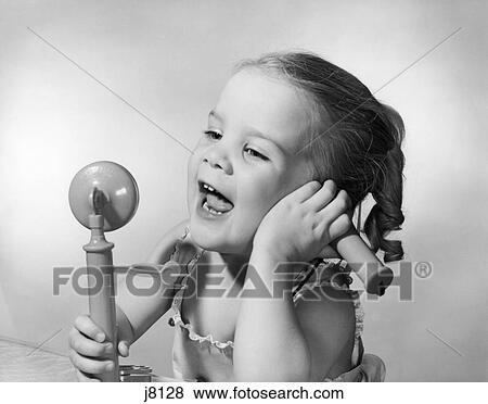 1950S Happy Little Girl Talking Into Toy Telephone View Large Photo Image Stock Photo - 1950S Happy Little Girl Talking Into Toy Telephone . Fotosearch