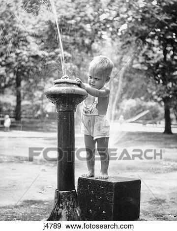 1950S Little Boy Playing In Water Drinking Fountain Central Park Nyc Usa View Large Photo Image Stock Photo - 1950S Little Boy Playing In Water Drinking Fountain Central Park Nyc Usa. Fotosearch