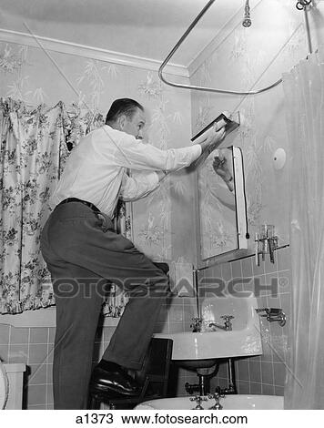 1950s Man On Home Repair Step Stool In Bathroom Replacing