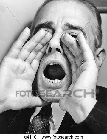1950s MAN SHOUTING WITH HANDS CUPPED AROUND HIS MOUTH OPEN WIDE View Large Photo Image Stock Image - 1950s MAN SHOUTING WITH HANDS CUPPED AROUND HIS MOUTH OPEN WIDE. Fotosearch