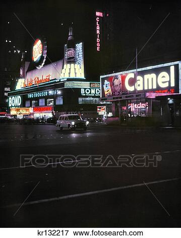 Stock Photo - 1950S Nght Times Square Manhattan Neon Signs Ads For Pepsi And Camels Marquee For The 1956 Movie The Ten Commandments. Fotosearch