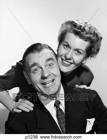 1950S Portrait Smiling Man And Woman Heads Touching Eager Facial Expression Looking At Camera View Large Photo Image Stock Photo - 1950S Portrait Smiling Man And Woman Heads Touching Eager Facial Expression Looking At Camera. Fotosearch